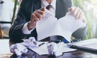 businessman tearing up contract