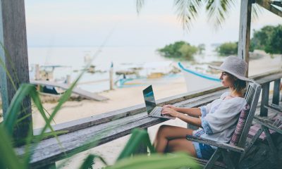 freelancer working on beach
