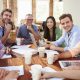 office workers happy in a meeting with coffee
