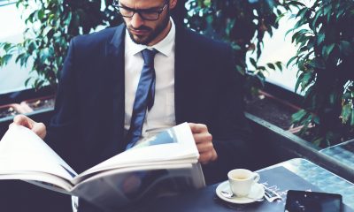 ceo reading newspaper